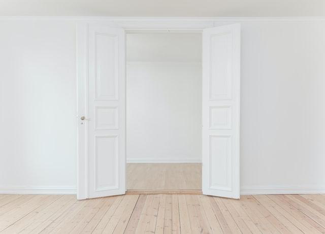 empty room with white walls and doors